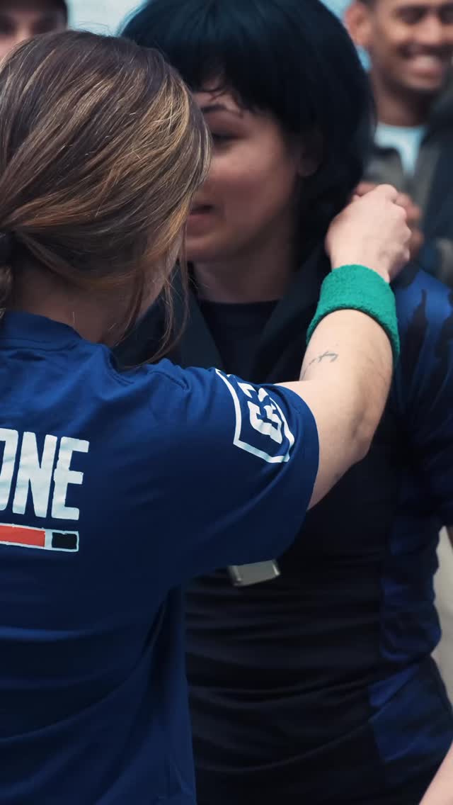 Two members celebrating at a competition